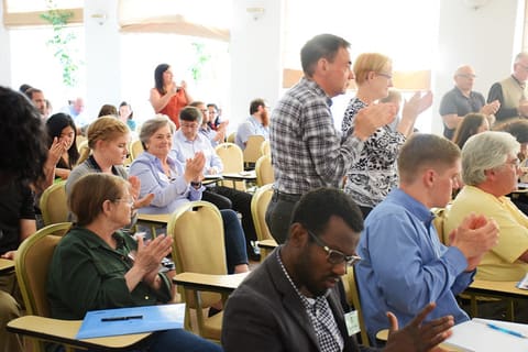 2017 Peace Corps partiipants applauding to the start of their joarney
