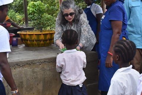 CDA sharing hot meal with kids provided by Mary's Meal through USAID Funding1