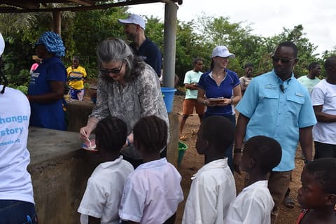 CDA sharing hot meal with kids provided by Mary's Meal through USAID Funding3
