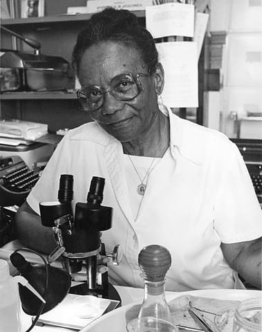 Sophie Lutterlough at a Microscope, 1983