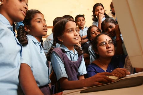 New Delhi Students Work with A Computer