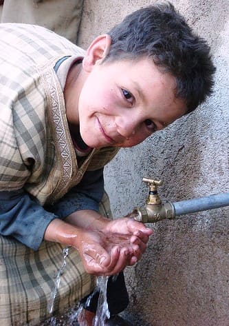 Moroccan boy_with_water_Large revised