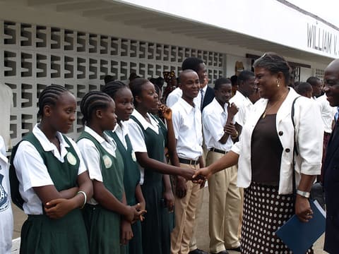 US Ambassador Thomas-Greenfield greets the students of William V.S. Tubman High School before the ceremony