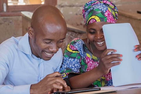 Teacher at Lumbo Primary School revising reading books2