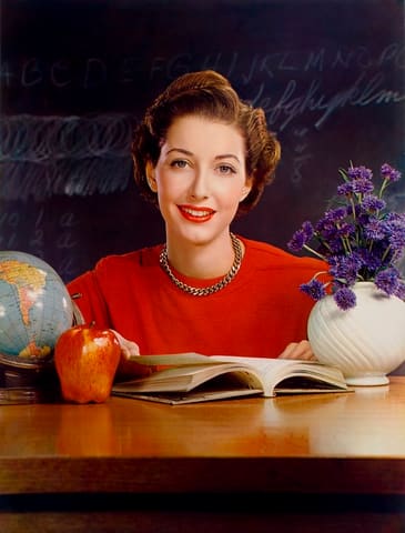 Timken Roller Bearing Co., calendar, September 1950, teacher at desk