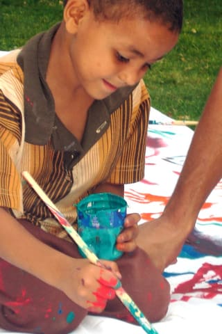 Young Boy Paints