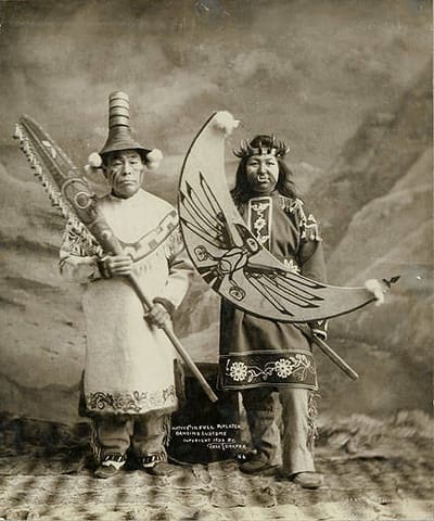 Tlingit man and woman in full dancing costumes, Alaska