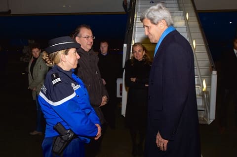 Secretary Kerry Speaks to French Gendarmarie Captain As He Arrives in France to Pay Homage to Paris Shooting Victims
